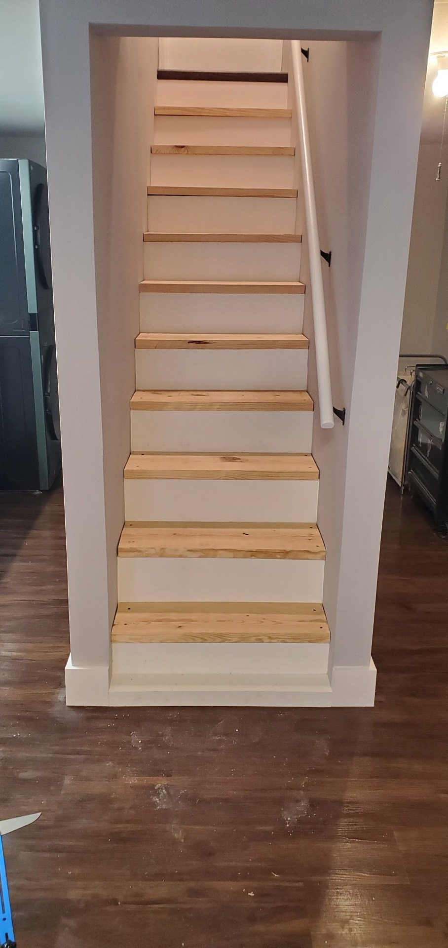 Rebuilt interior staircase with new wood treads and handrail